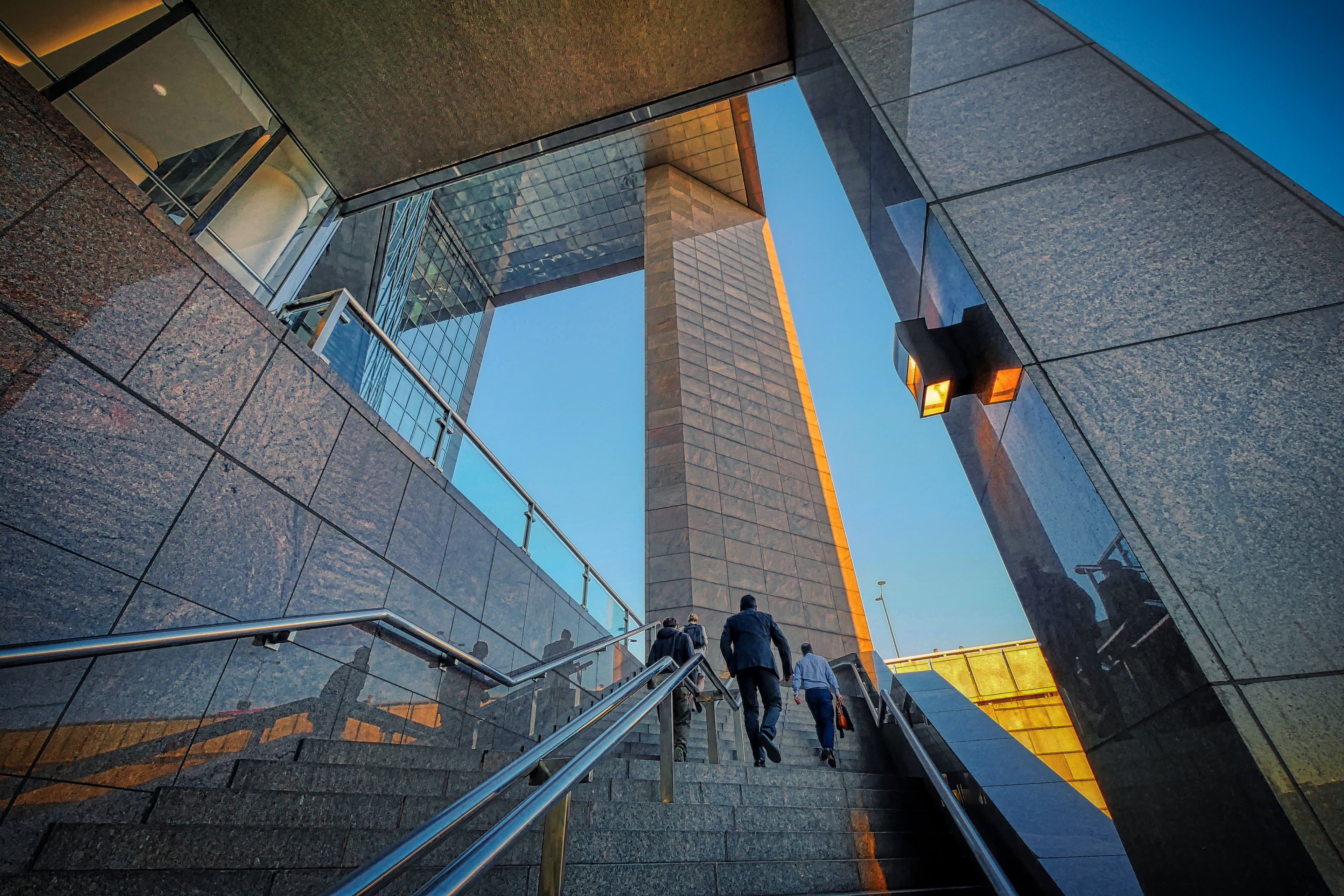 People moving through a contemporary office interior